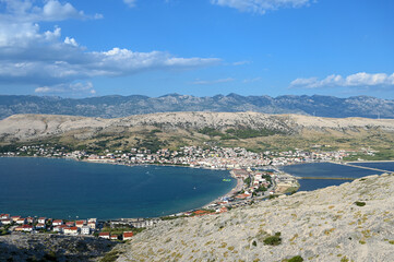 Town Pag. Nature on island Pag, Croatia. Hills, blue Adriatic sea and mountain Velebit in distance. 