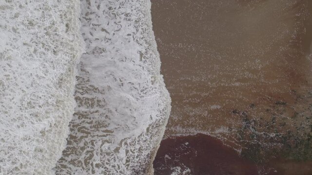 Ocean Waves Creating White Water on the Shores of a Beach