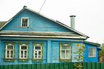 Country house in Russia. Blue wooden house. Rural life. Russian architecture.