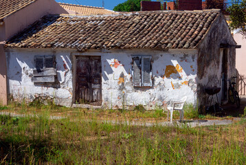 Kerkyra. Greece. An old white poor hut on the lawn.