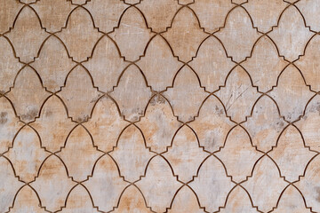 Geometrical arabesque tile pattern in a wall - obrazy, fototapety, plakaty