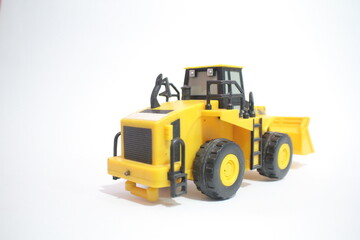 yellow bulldozer isolated on white