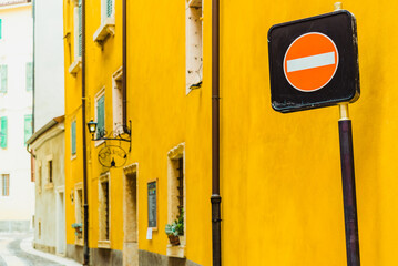 Forbidden direction sign in a narrow lane in a European town.