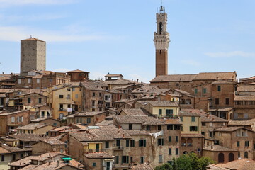 Fototapeta na wymiar Cityscape of Siena with Mangia Tower, Italy