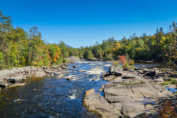 Penobscot River surrounded by early fall foliage in Baxter State Park Maine