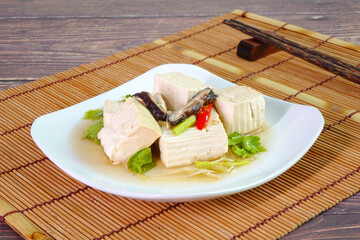 Tofu. Steamed White tofu with soy sauce. Chinese Traditional vegetarian food.