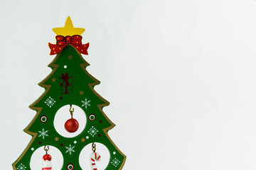 Christmas tree with decorations on white background. Christmas ornament. Selective focus.