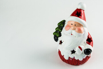 Santa Claus isolated on white background. Christmas ornament. Selective focus.