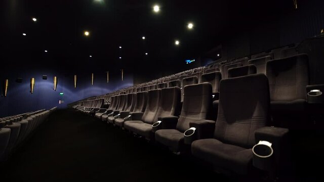 Empty movie theater with black seats - big cinema
