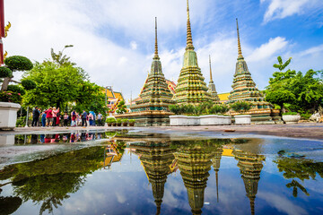 Beautiful pagoda of Wat Pho temple complex against blue sky sightseeing travel in Bangkok