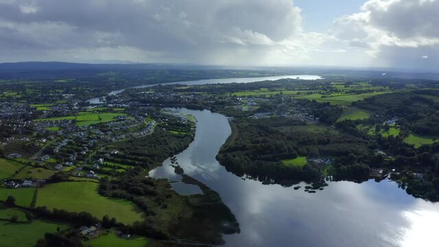 Killaloe, County Clare, Ireland, September 2021. Drone gradually ascends while pulling backwards from the town while looking south from Carrowgar Bay.