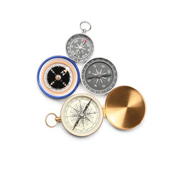 Different compasses on white background