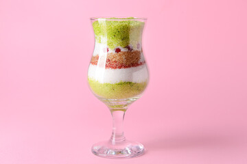 Glass with sweet sugar on color background