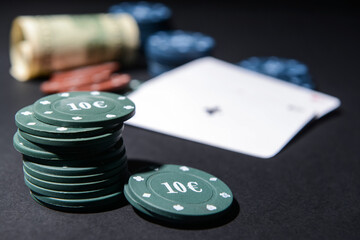 Poker chips on dark background