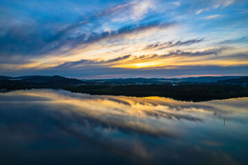 Sunrise and cloud reflections waterscape