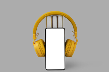 Modern mobile phone, headphones and books on grey background