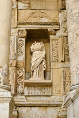 A marble statue of Episteme (Knowledge) stands in a niche of the ruined Roman facade of the Library of Celsus, Ephesus, Turkey