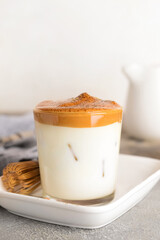 Glass of tasty dalgona hojicha and chasen on table