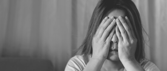 Obraz premium A woman sitting stressed, depressed, insomnia who broke up with her boyfriend.