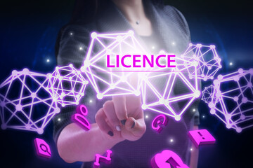 Business, Technology, Internet and network concept. Young businessman working on a virtual screen of the future and sees the inscription: Licence