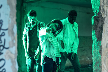 Scary zombies in ruined building