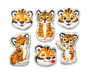 Cute cookies in shape of tiger for New Year 2022 on white background