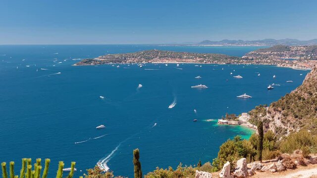 Beautiful view of yachts and boats floating arizbg in a bay in Nice with clear turquoise water, Nice, C&ocirc;te d'Azur, France