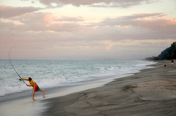Beach Fishing in New Zealand at sunset