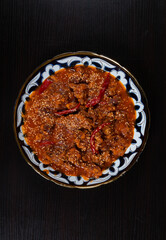 Asian food. Beef in spicy sauce with sesame seeds and chili pepper