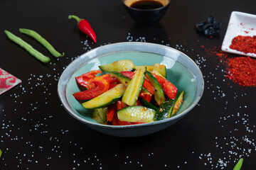 Fototapeta na wymiar Salad with cucumbers and tomatoes. Vegetarian food