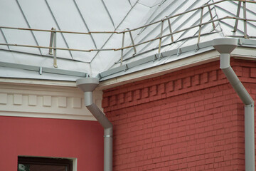 Building roof fencing. Modern metal roof fence for security.