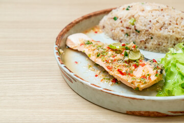 quinoa fried rice with steamed salmon in lime chilli dressing
