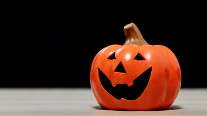 Halloween festival pumpkin Jack O lantern on wooden table