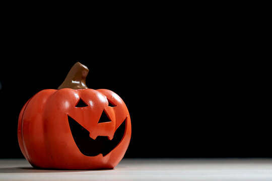 Halloween festival pumpkin Jack O lantern on wooden table