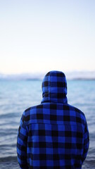 Fototapeta premium Male in the ocean, Cold winter, Blue coat.