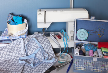 Sewing pillowcases from cotton fabric percale on the sewing machine at home. Sewing accessories...