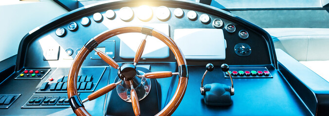 Steering wheel on luxury yacht