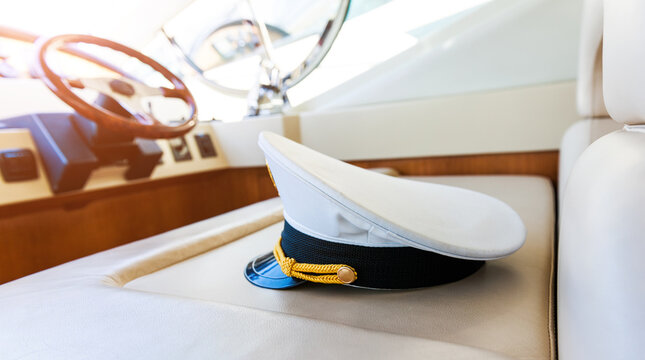 Rudder and captain's hat on yacht