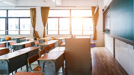 Empty modern classroom with chairs, desks and chalkboard