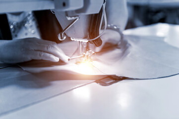 Hand sewing material on a machine