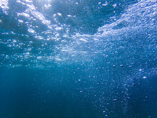 Underwater bubbles with sunlight. Underwater background bubbles, Air bubbles underwater rising to water surface, natural scene, Mediterranean sea, Underwater with bubble. Great for backgrounds.