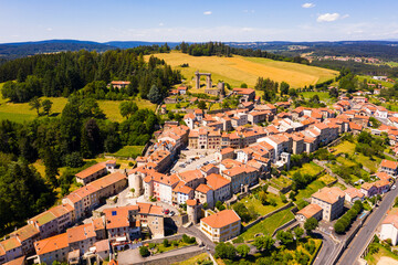 General view of village of Allegre overlooking medieval ruined castle in summer, Haute-Loire, France.