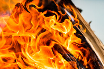 Empty hot charcoal barbecue grill with bright flame. Hot burning grill, outdoors cooking food