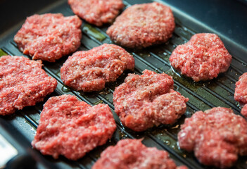 Frying four round beef meat for hamburger