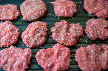 Frying four round beef meat for hamburger