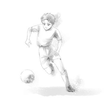 サッカーボールを追う少年