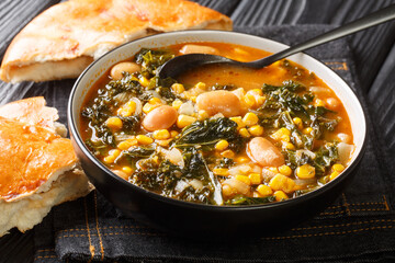 Hearty Black Sea Soup Kale or Karalahana Corbası close-up in a bowl on the table. horizontal