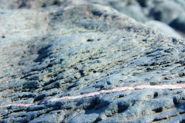 Red Quartz Through Grey Rock
