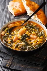 turkish soup lahana corbası Tarifi turkish soup with kale, beans and corn close-up in a bowl on the table. vertical