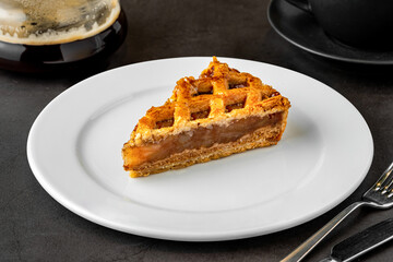 Delicious apple tart and brew coffee on dark stone floor